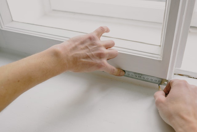 marking measurements on a window sill